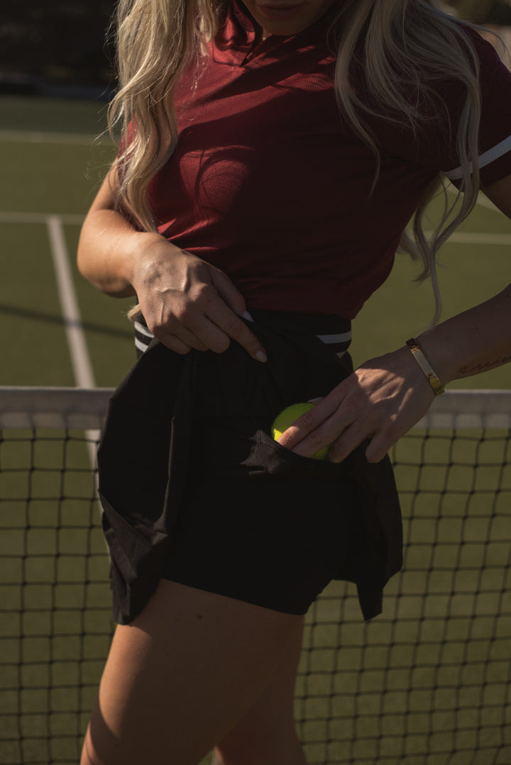 Lost Members Club women’s skort, pleated black design for sport